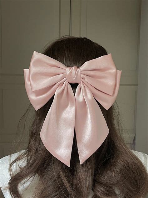 all black with pink bow.